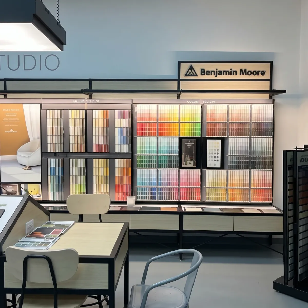 Benjamin Moore color swatch wall and studio seating inside Kwikze Paint